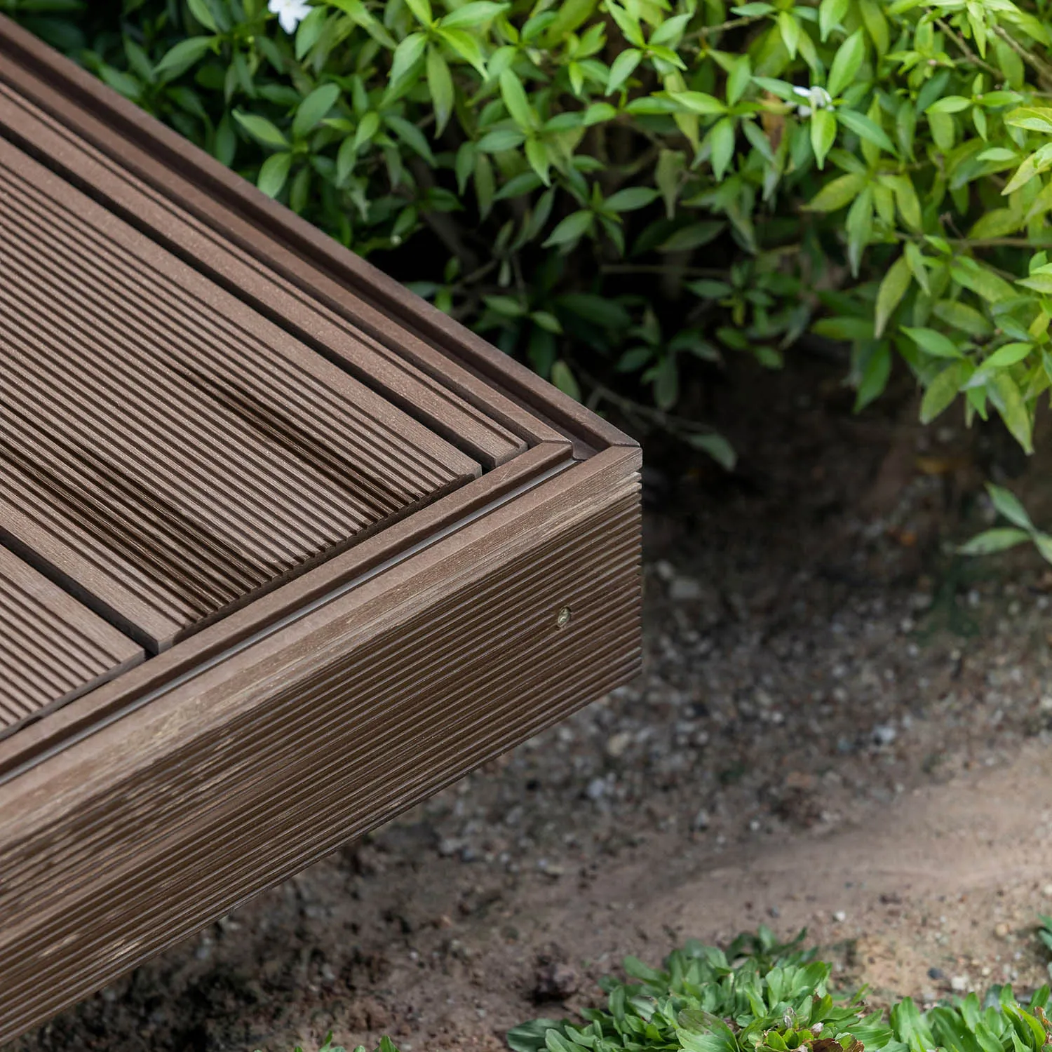 Close-up of modern outdoor furniture made of teak wood.