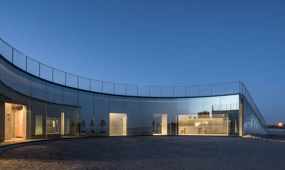 Modern building with all-glass facade at night
