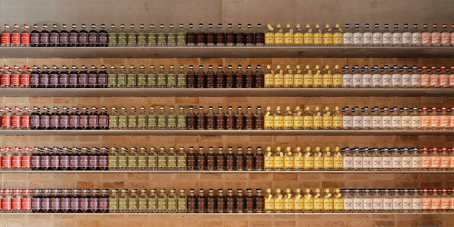 Various bottles of alcohol displayed in a store or bar