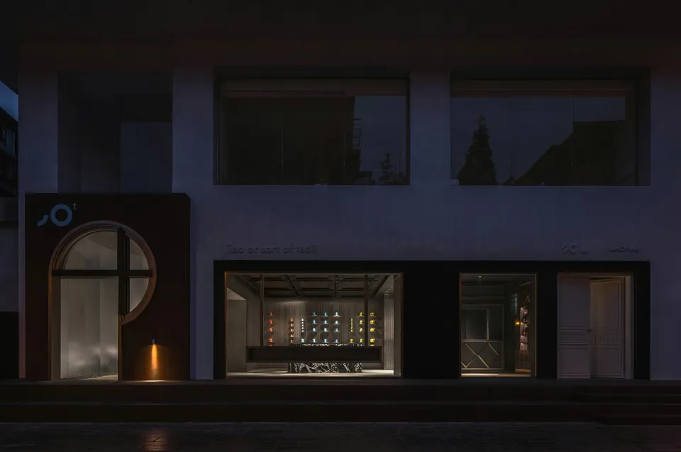 Minimalist storefront with glass windows at night
