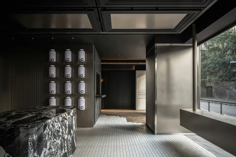 Modern retail storefront entry with metal and glass materials