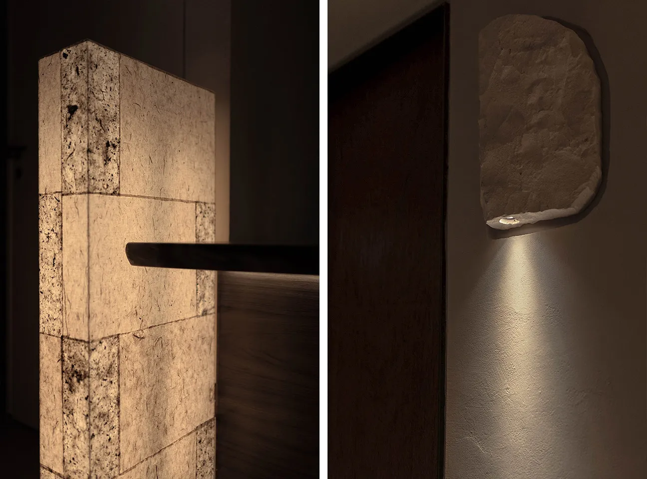 A minimalist interior design featuring a stone wall and wooden floor.