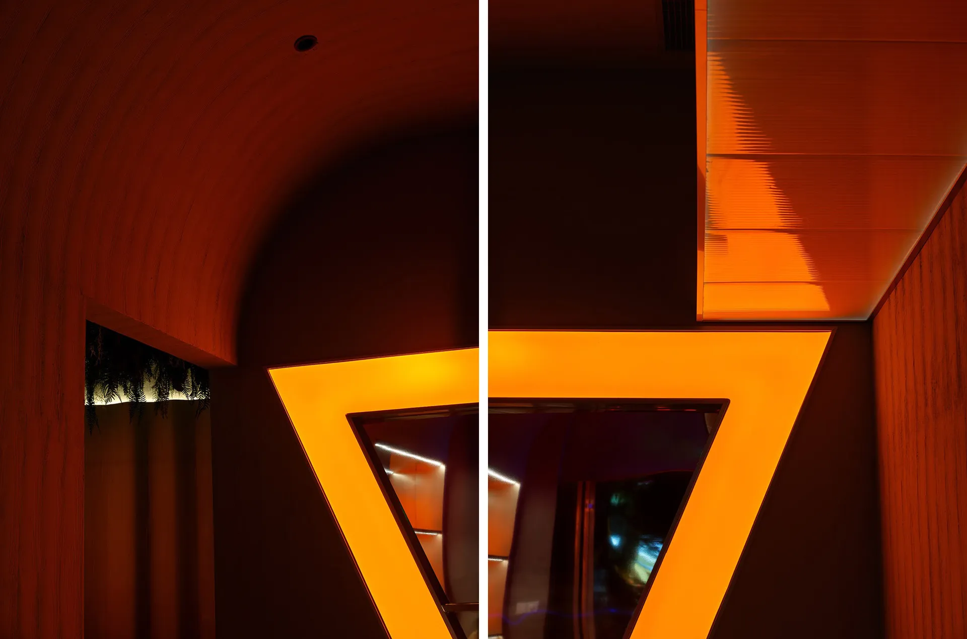 Architectural interior design featuring a modern triangular lighting feature.
