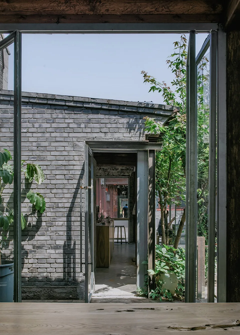 A rustic, industrial-style building with brick walls and an open, airy interior.