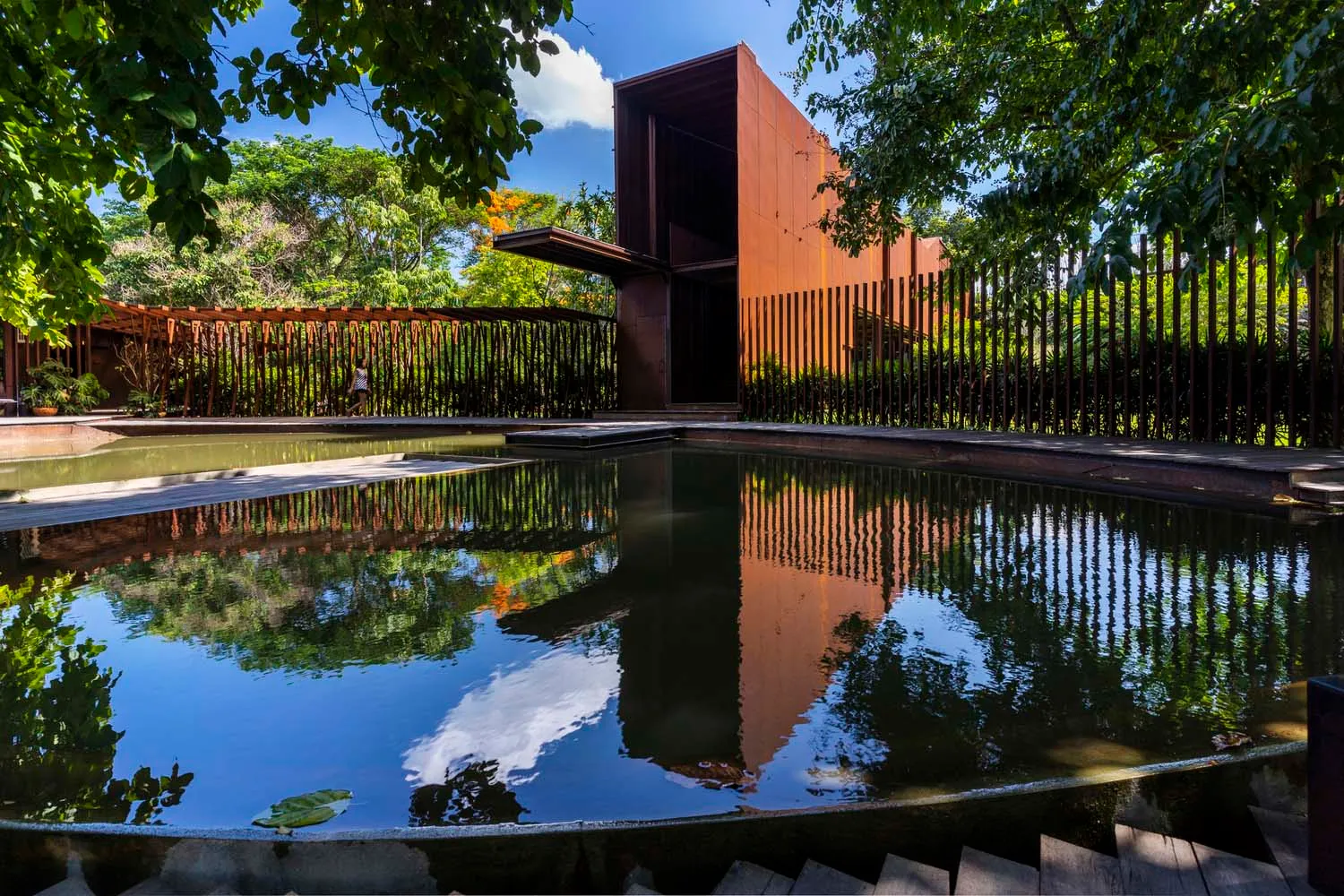 A modern architectural water feature with metal and concrete elements.