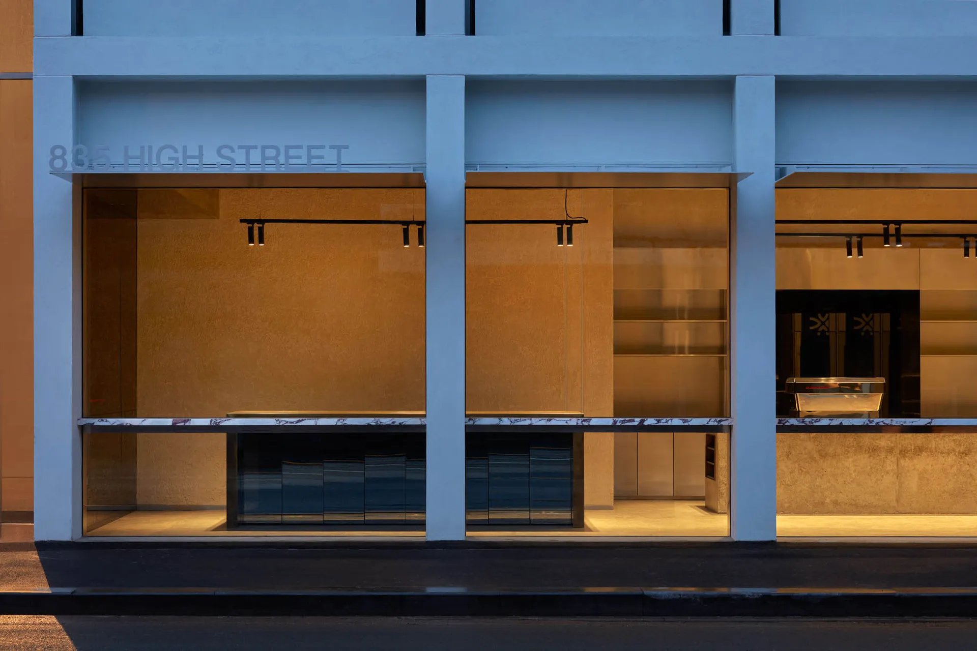Modern storefront with large glass windows and minimalistic design.