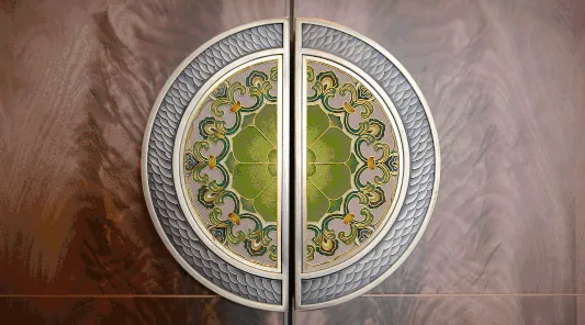 Metal circular ornament with intricate green glass mosaic