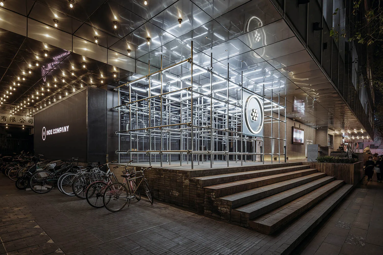 A modern interior space featuring a metallic grid structure.
