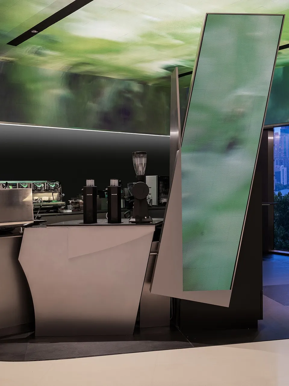 A modern coffee shop counter featuring retro mirrors and metal materials.