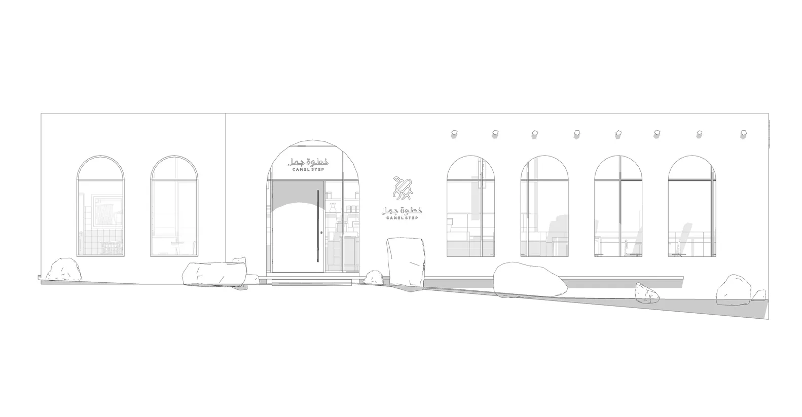 Modern retail storefront with concrete facade and large arched windows.