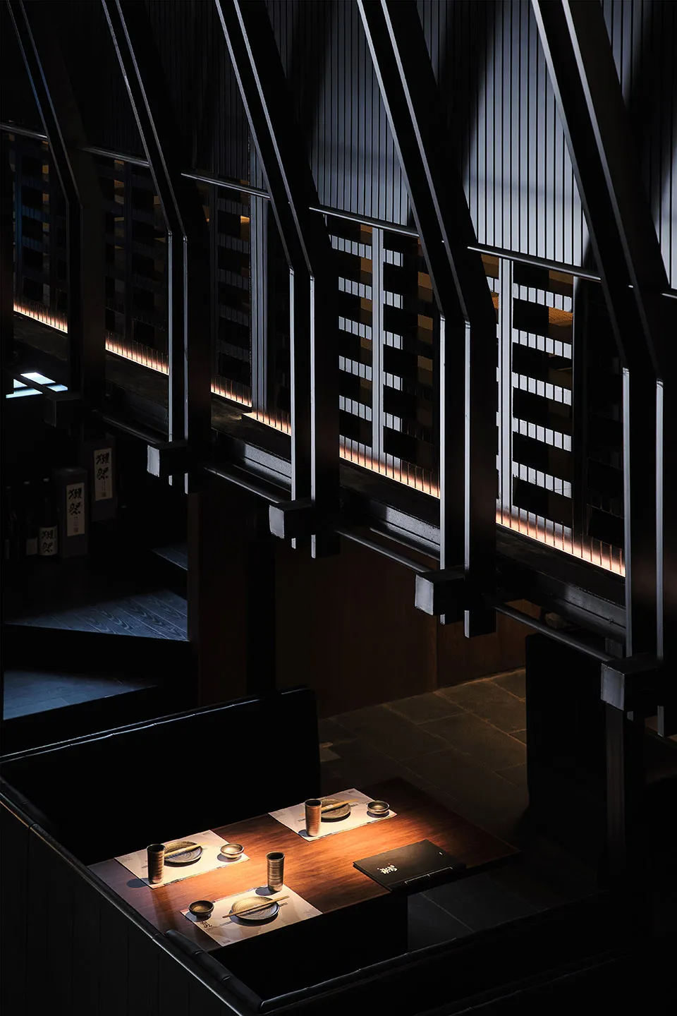 A modern interior design featuring dark wood elements.