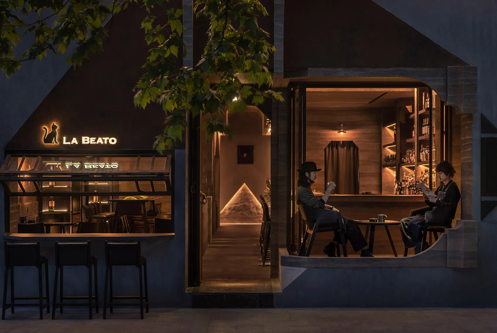A cozy, modern restaurant bar with wooden finishes and a warm, inviting atmosphere.