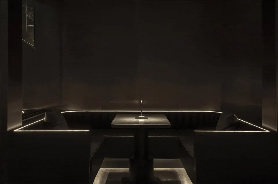Industrial-inspired restaurant booth with metal accents