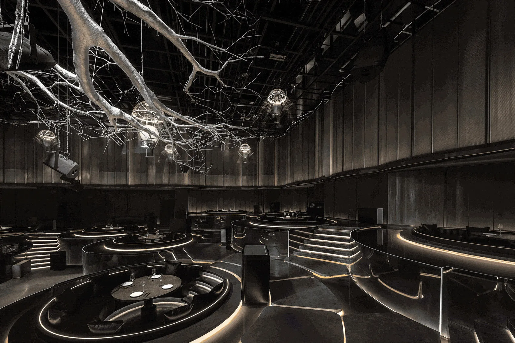 Modern industrial design restaurant with metallic, glass, and wooden decor
