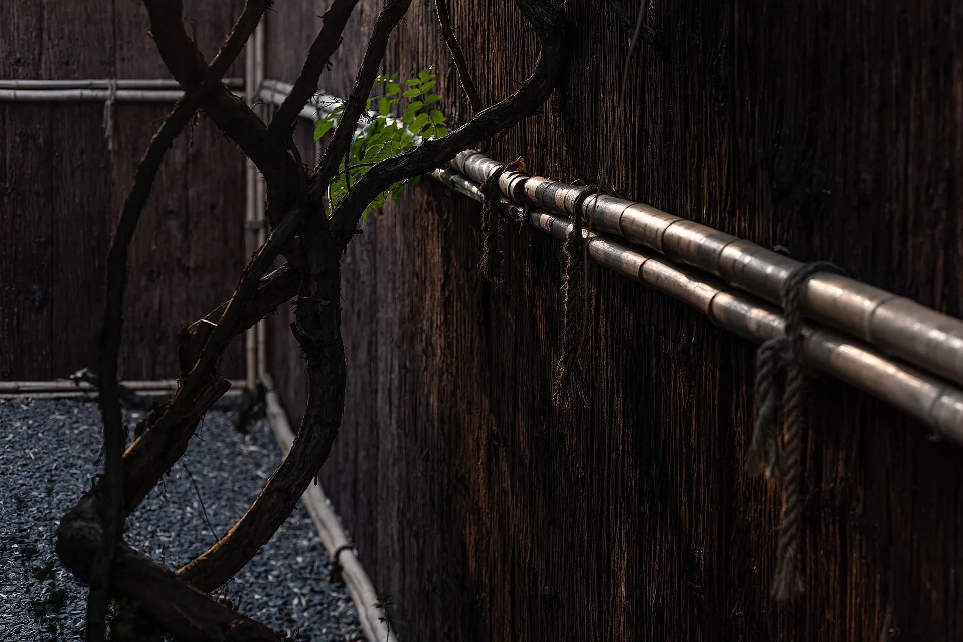 Minimalist wooden barrier with metal pipes attached