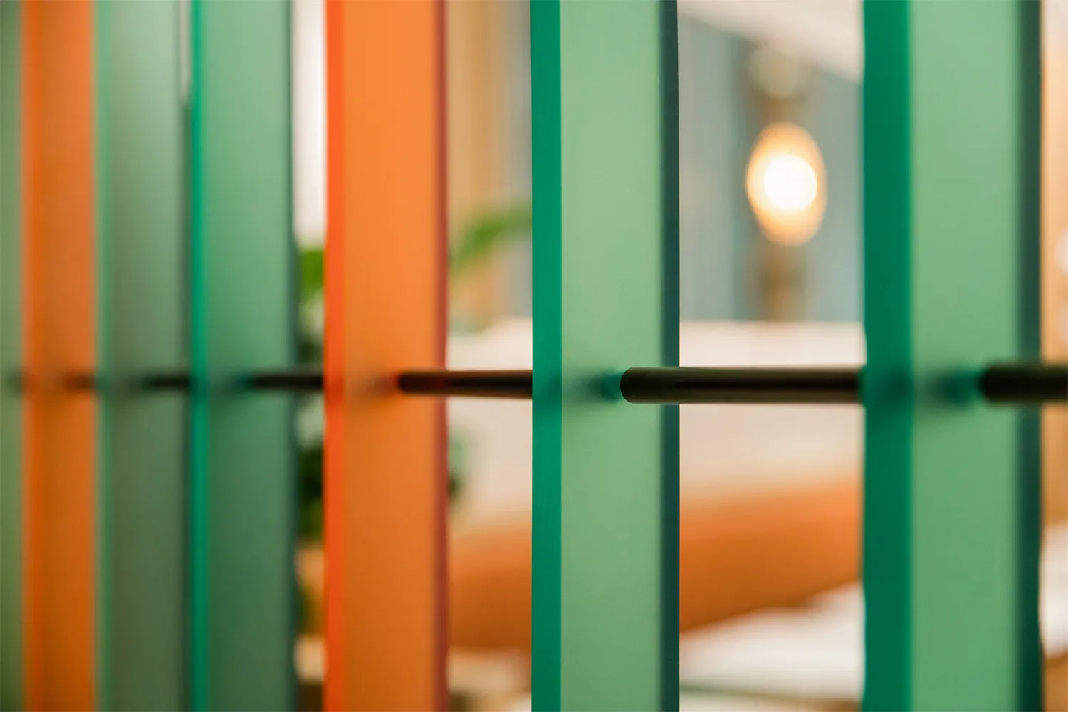 Modern, minimalist interior design featuring glass barriers and metallic accents.