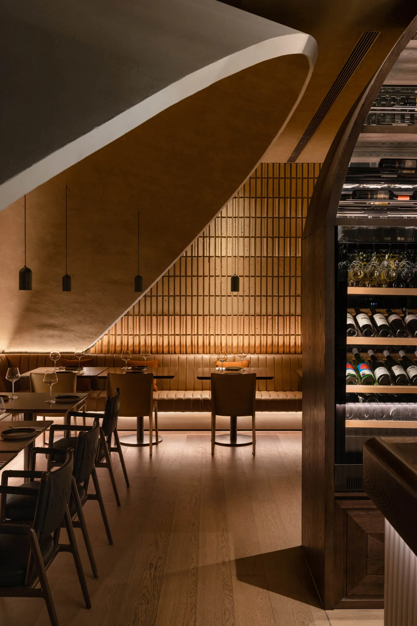 Modern restaurant interior with wooden furniture and concrete walls