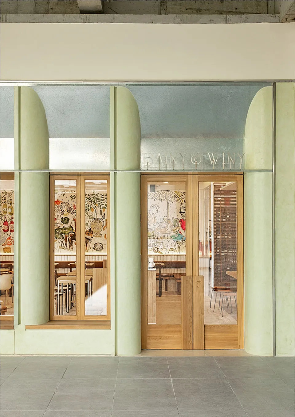 Modern restaurant shopfront featuring wooden elements and glass panels