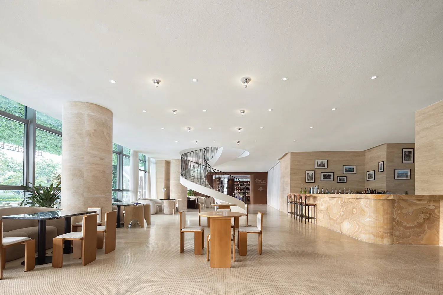 Lobby interior with minimalist design and natural marble materials.