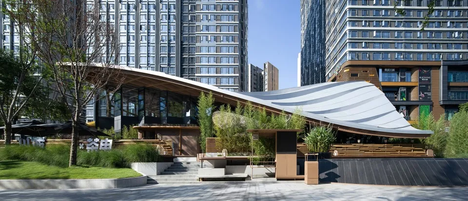 An image of a modern architectural design featuring commercial space with a concrete roof, wooden and metal accents, and glas