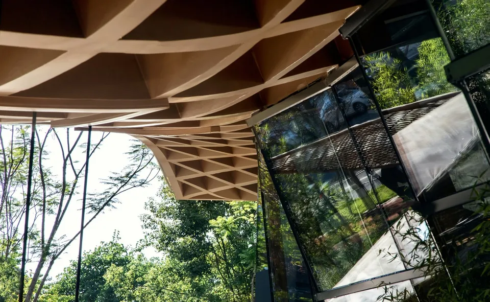 An architectural design featuring modern materials like metal, glass, and concrete in a public space setting.