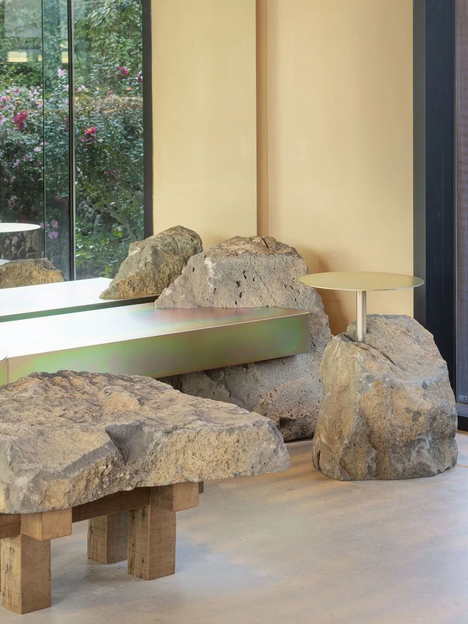 A modern interior featuring stone and concrete materials