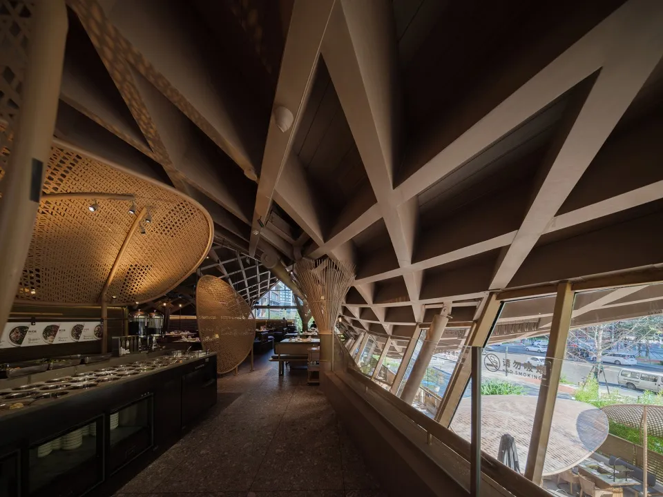 Modern restaurant interior with wooden accents and large windows