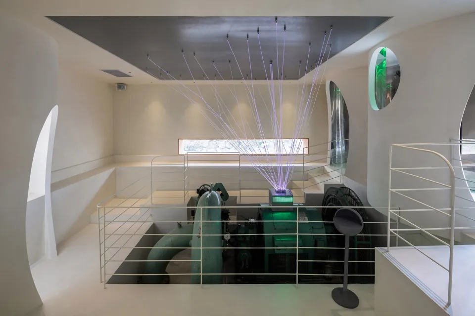 An industrial-style architectural exhibition featuring a concrete interior design.