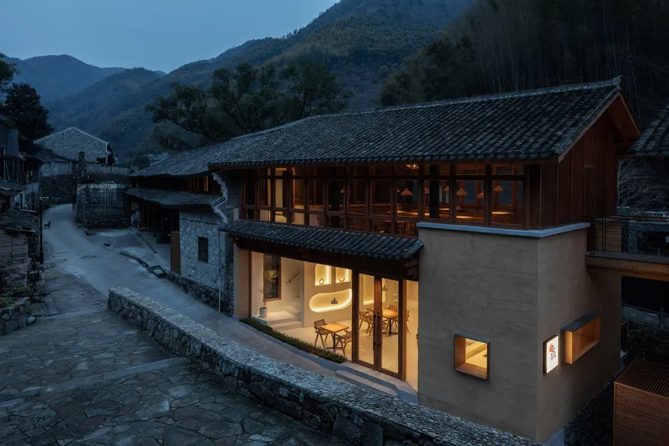 Modern restaurant exterior with wooden frame and glazed roof tiles
