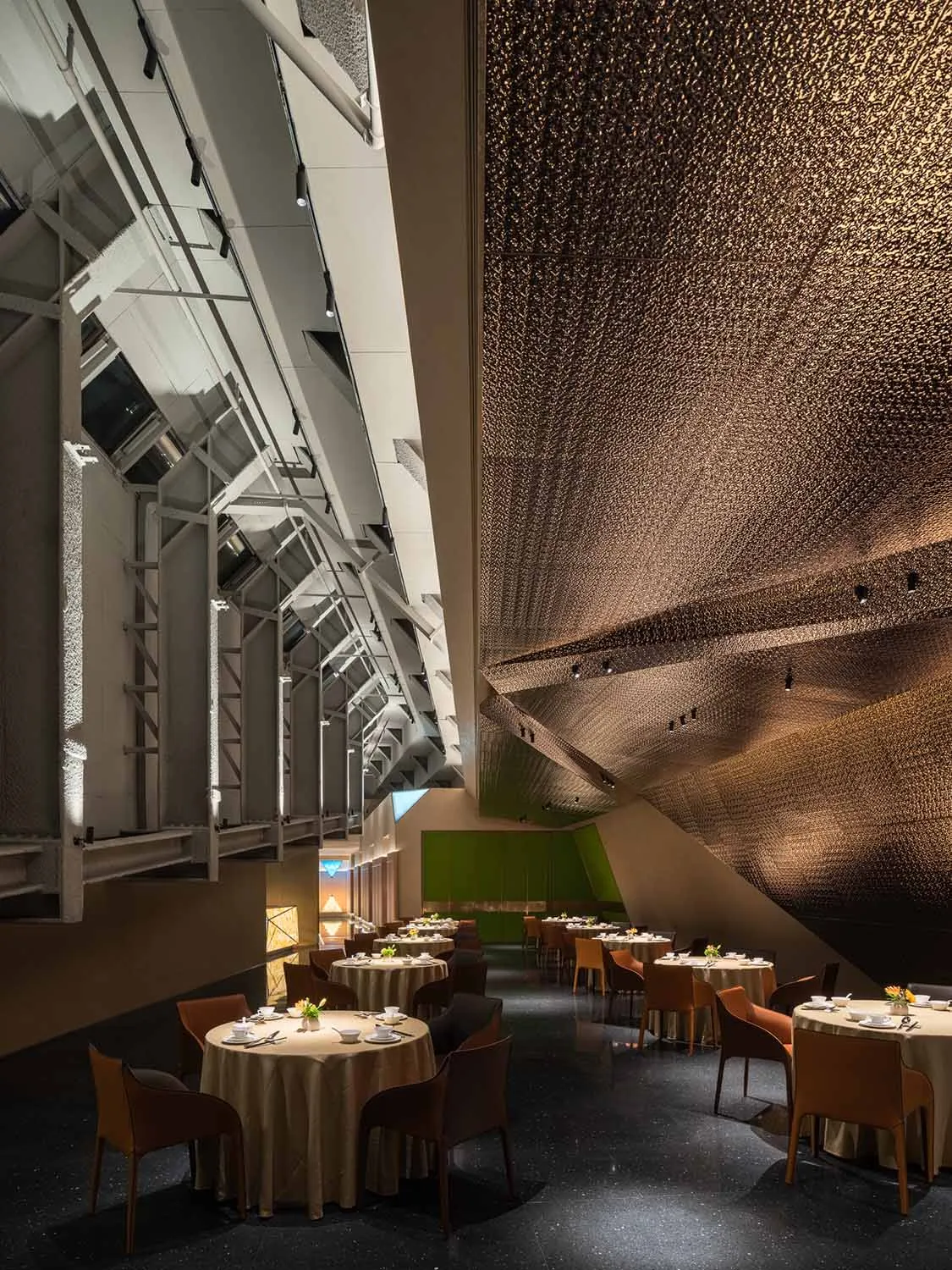A modern restaurant interior featuring a metal ceiling.