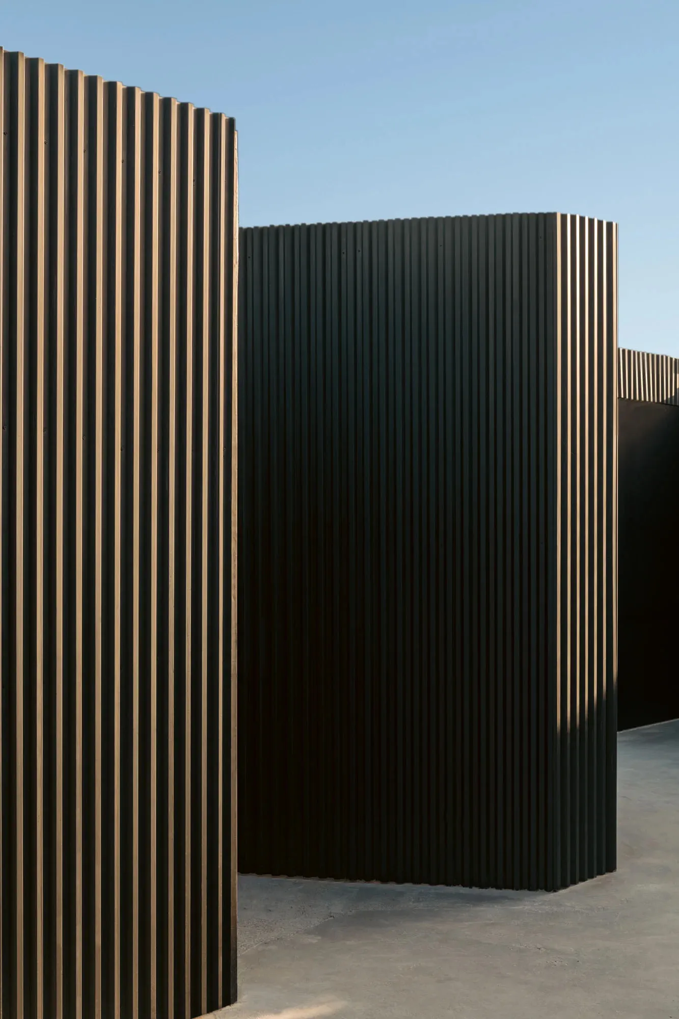 Modern, minimalist black metal wall panels