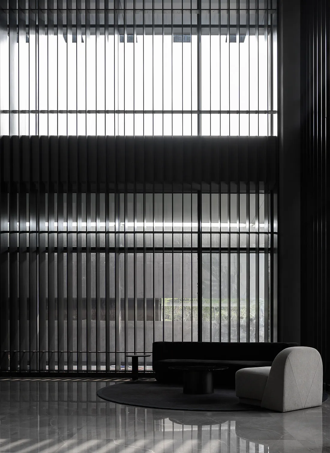 Modern lobby featuring metallic furniture and a minimalist design aesthetic.