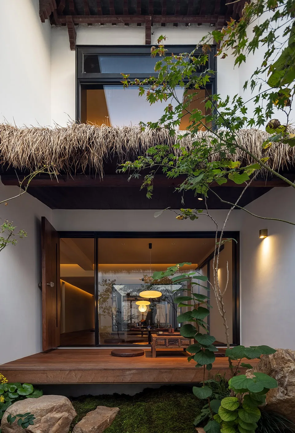 A traditional Chinese interior featuring wooden elements and thatched roof elements.