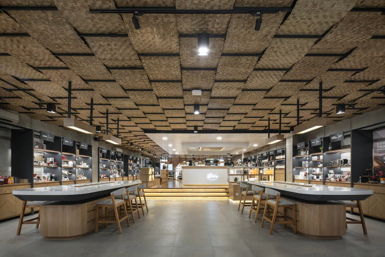 A cozy coffee shop features a unique bamboo ceiling design, providing a comfortable atmosphere for visitors.