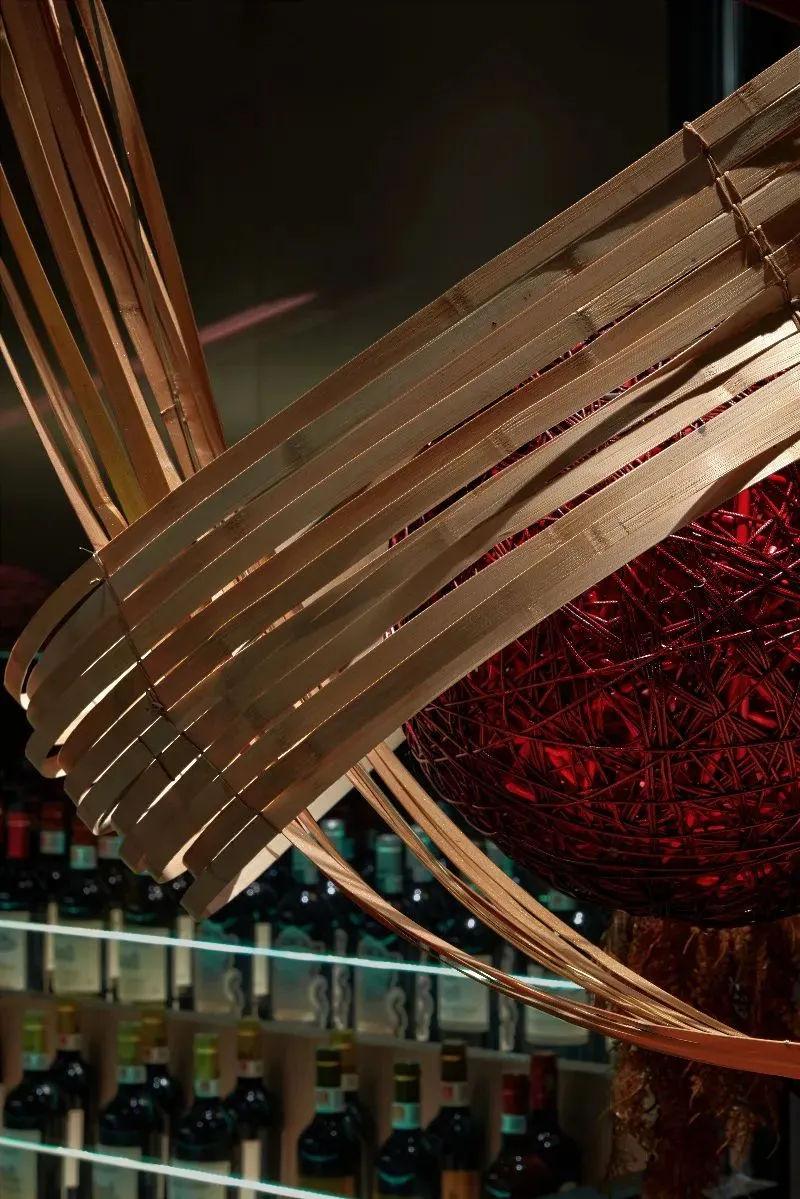 Bamboo woven lighting fixture hanging in a restaurant interior