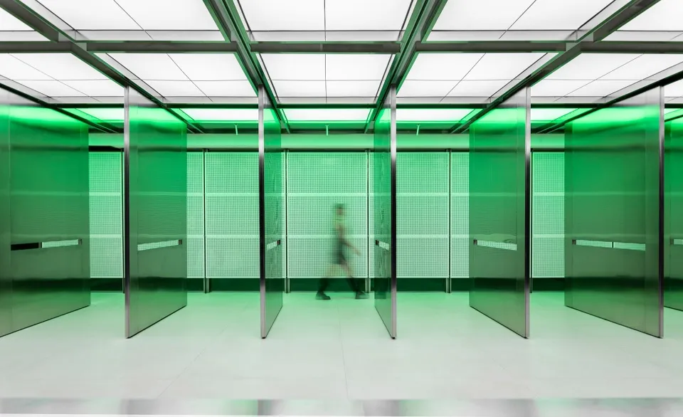 A minimalist interior design featuring glass walls and a white floor.