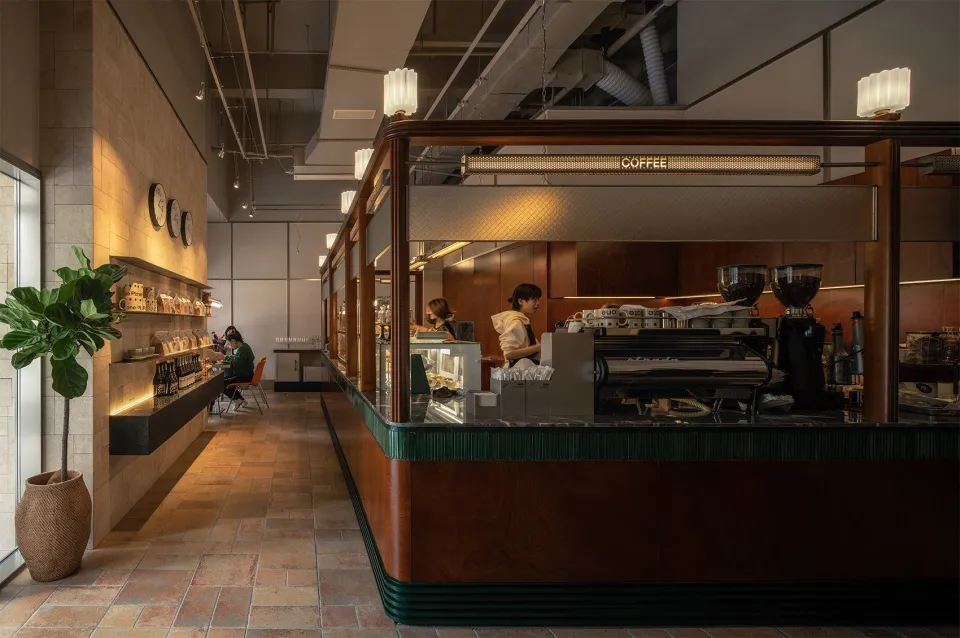 A modern coffee shop featuring wooden interior design elements.