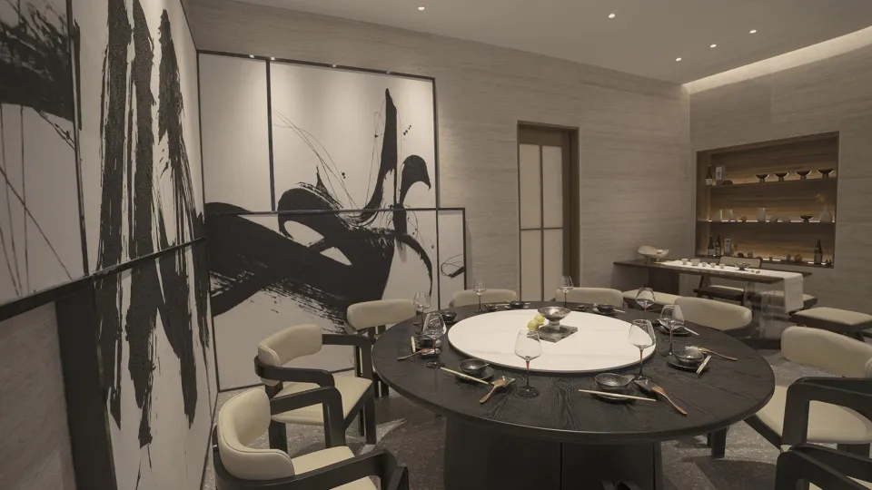 Modern dining room with black and white decor, featuring a round table, chairs, and abstract wall art.