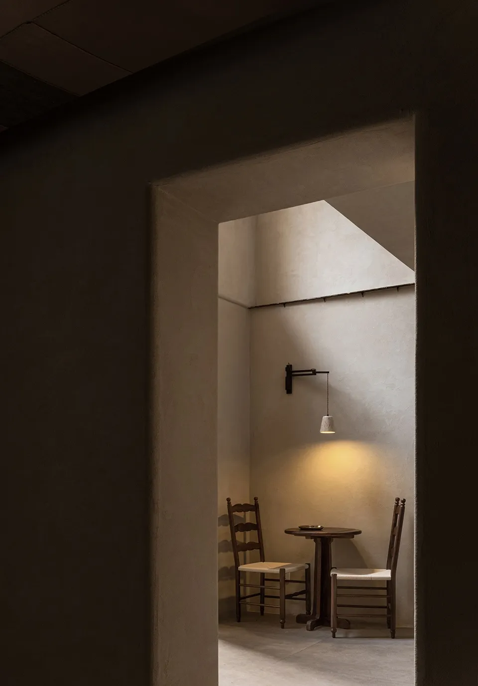 A minimalist interior space featuring natural stone materials