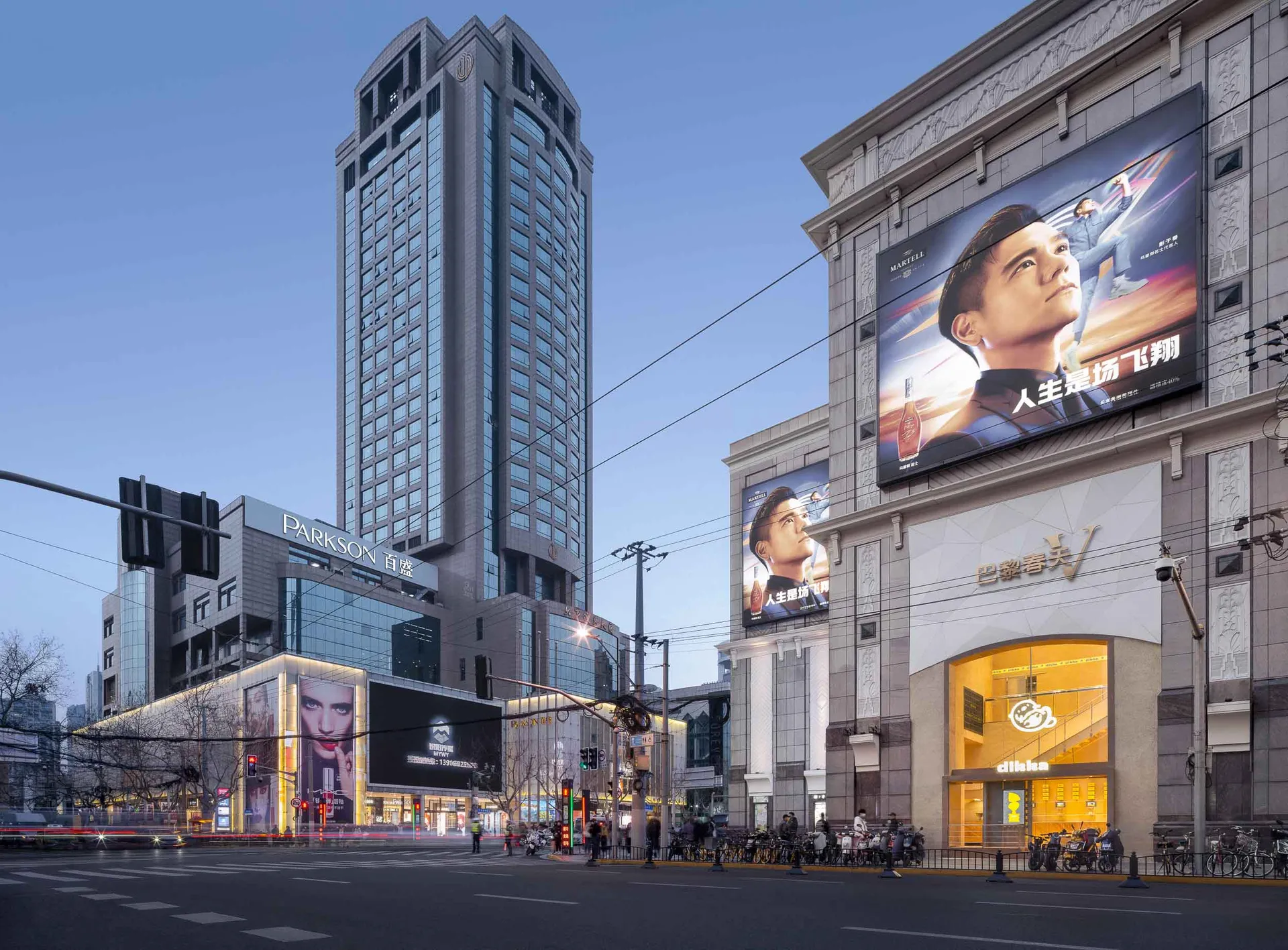 Modern high-rise buildings with large billboard advertisements.