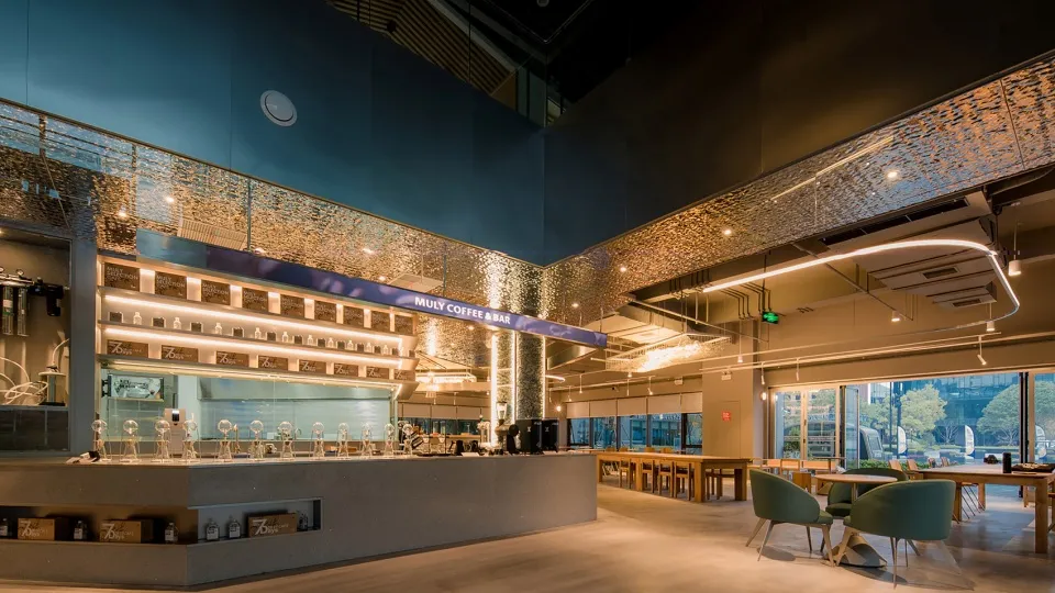 Interior design of a modern coffee bar featuring metallic sheets