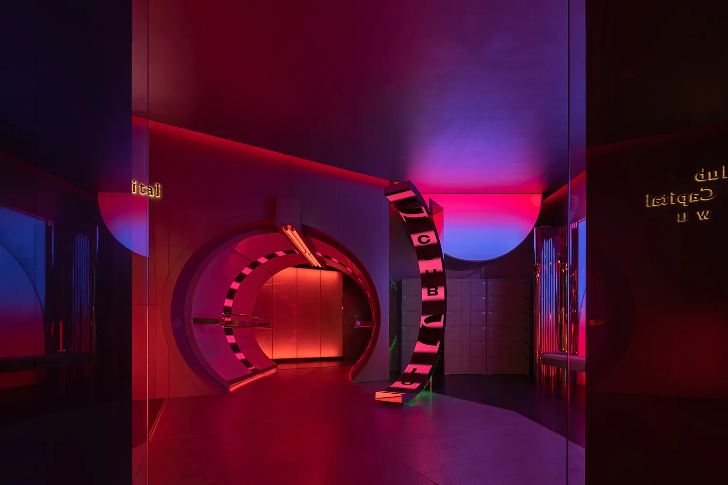 A modern nightclub entrance with metallic and mirrored surfaces.