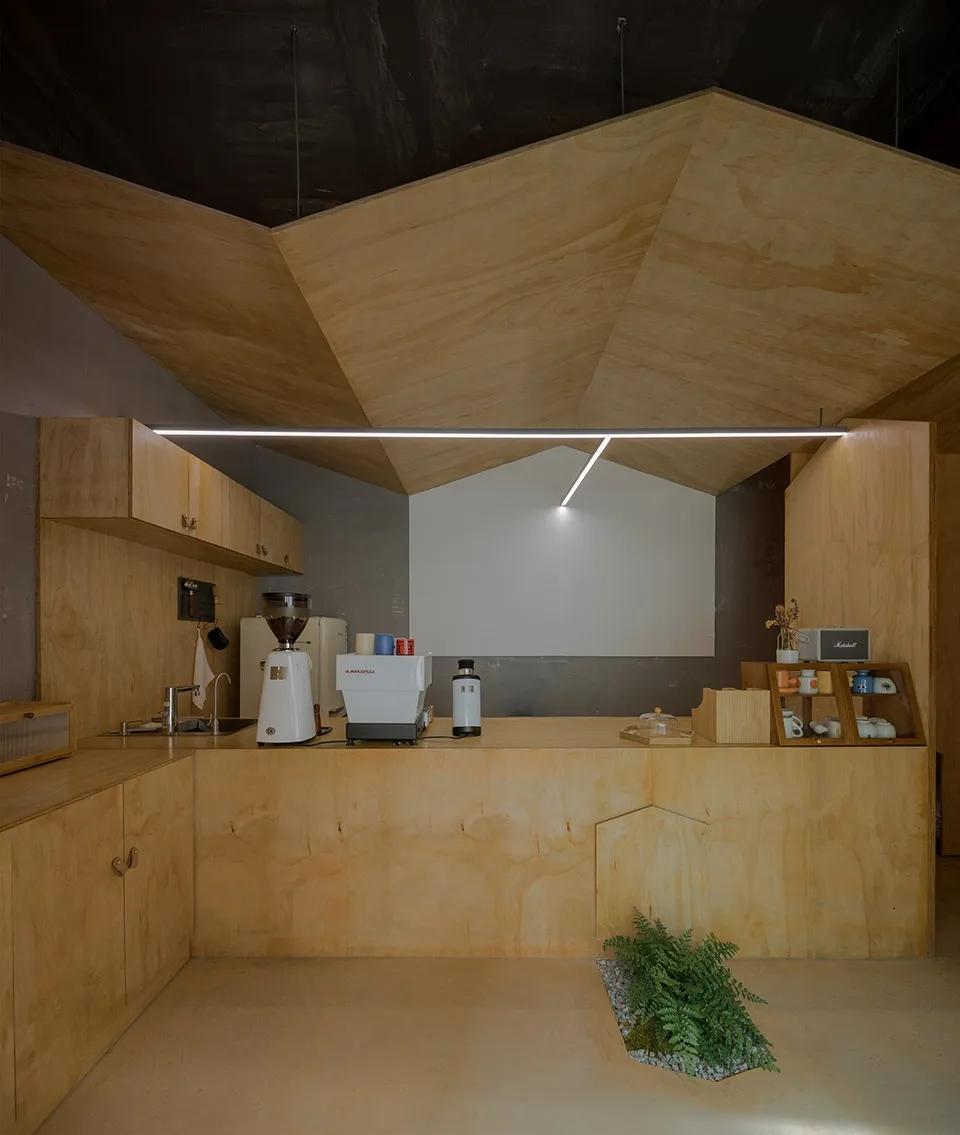A minimalist coffee shop counter made of wood.