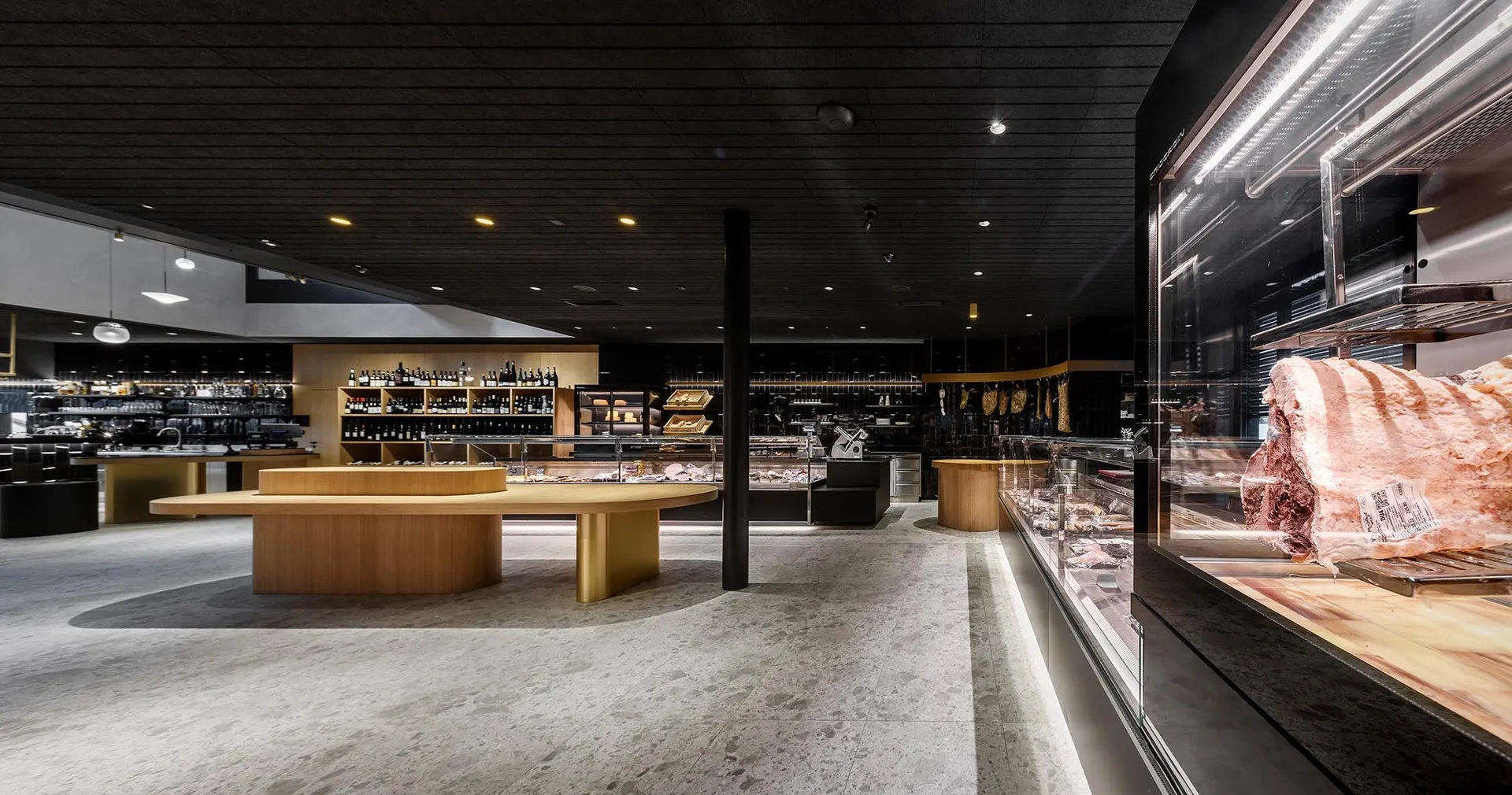 Modern restaurant interior featuring a wooden floor and counter.