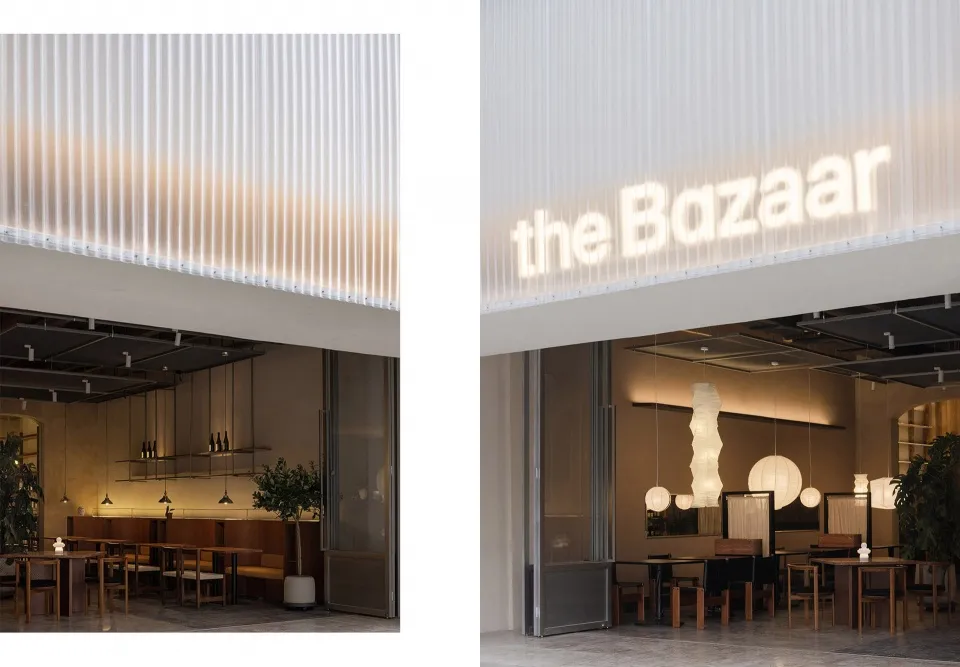 A modern restaurant interior with warm lighting and minimalist design.