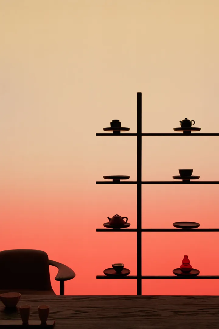 Shelf with decorative items on a wooden table at sunset.