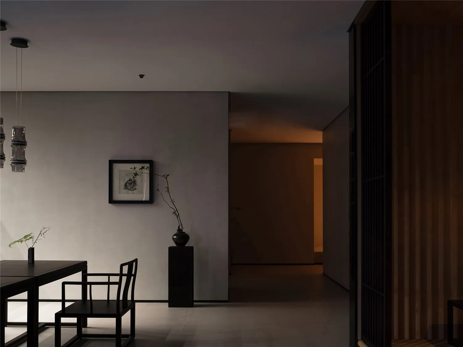 A modern living space featuring concrete flooring and wooden blinds.