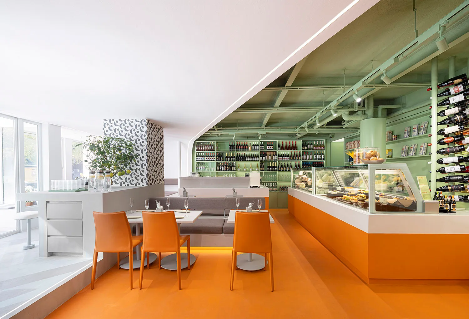 An open-concept restaurant featuring modern design elements such as metal, wood, and glass.