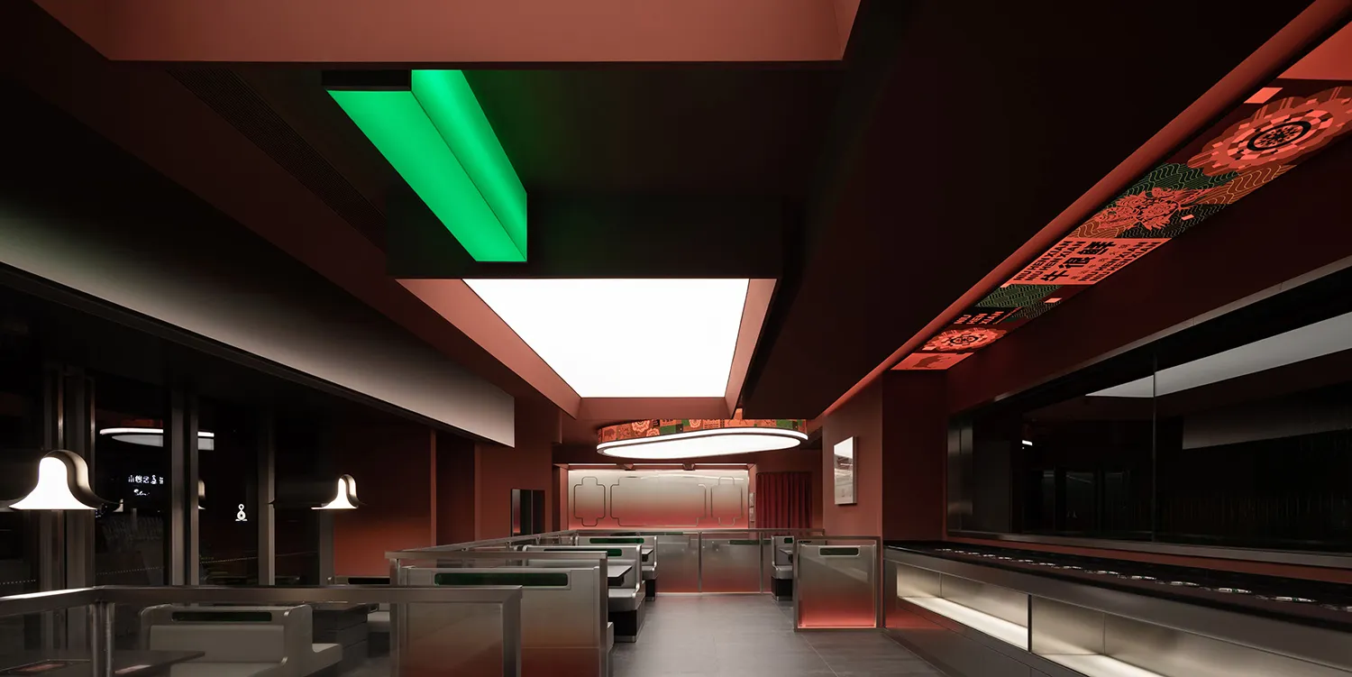The modern interior design of a restaurant featuring steel, glass, and terrazzo materials.