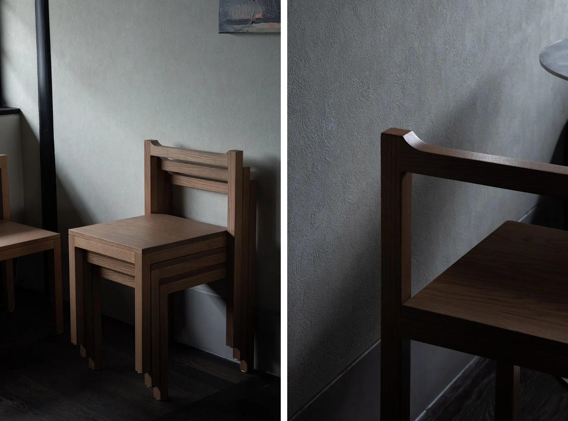 Minimalist wooden furniture stack against a textured gray wall, showcasing clean lines and natural materials.
